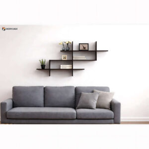 Minimal floating wall shelf above sofa for modern living room decor in Bangladesh