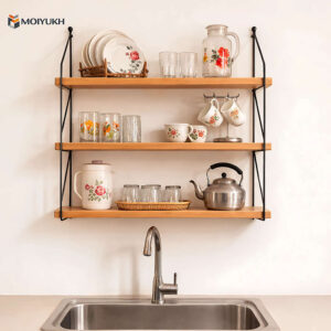 Wooden kitchen wall shelf with multiple tiers for storage and display above sink in Bangladesh home
